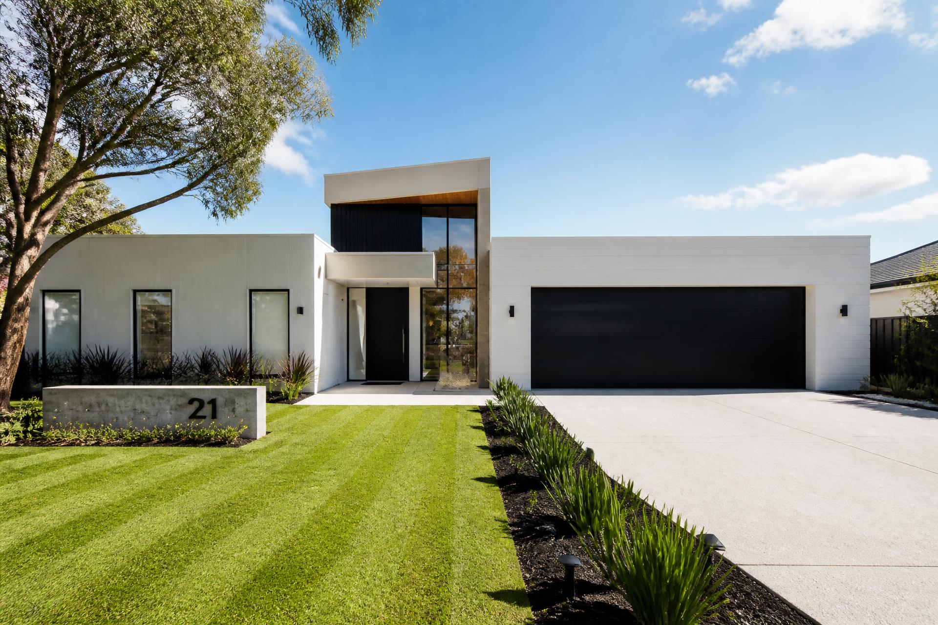 Luxury modern Sydney home with a freshly mowed lawn and clean driveway